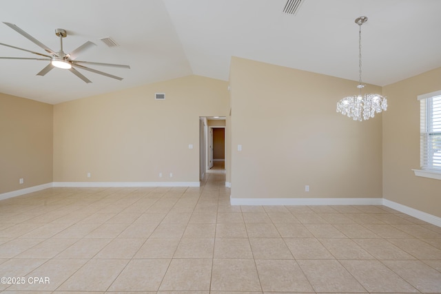 spare room featuring light tile patterned floors, ceiling fan with notable chandelier, and lofted ceiling