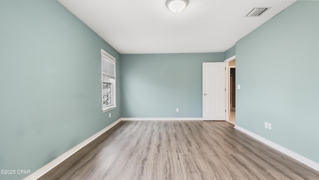 empty room featuring light hardwood / wood-style floors