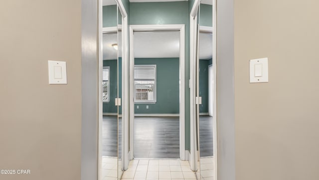 hallway with light tile patterned floors