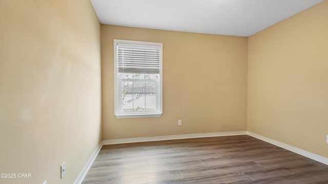 empty room with light hardwood / wood-style flooring