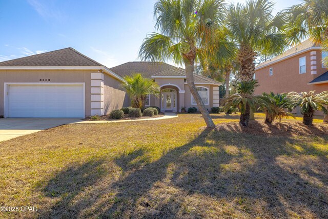 view of front facade featuring a garage and a front yard