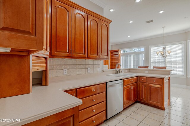 kitchen with sink, decorative light fixtures, stainless steel dishwasher, kitchen peninsula, and a chandelier