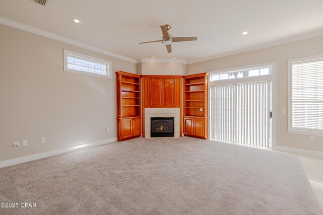 unfurnished living room featuring light carpet, a fireplace, and ornamental molding