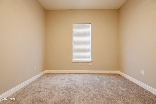 laundry area with light tile patterned floors, sink, cabinets, and stacked washing maching and dryer