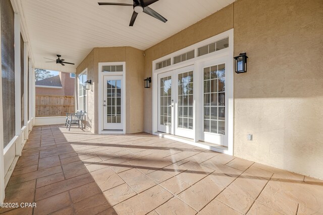 view of patio / terrace featuring ceiling fan and french doors