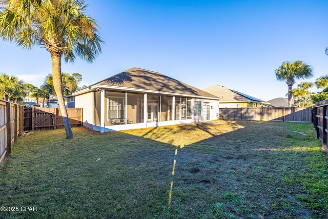 rear view of house with a lawn