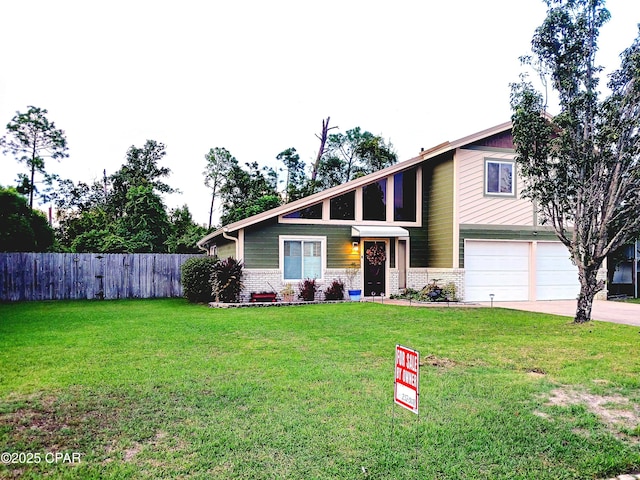 view of front facade featuring a front lawn and a garage