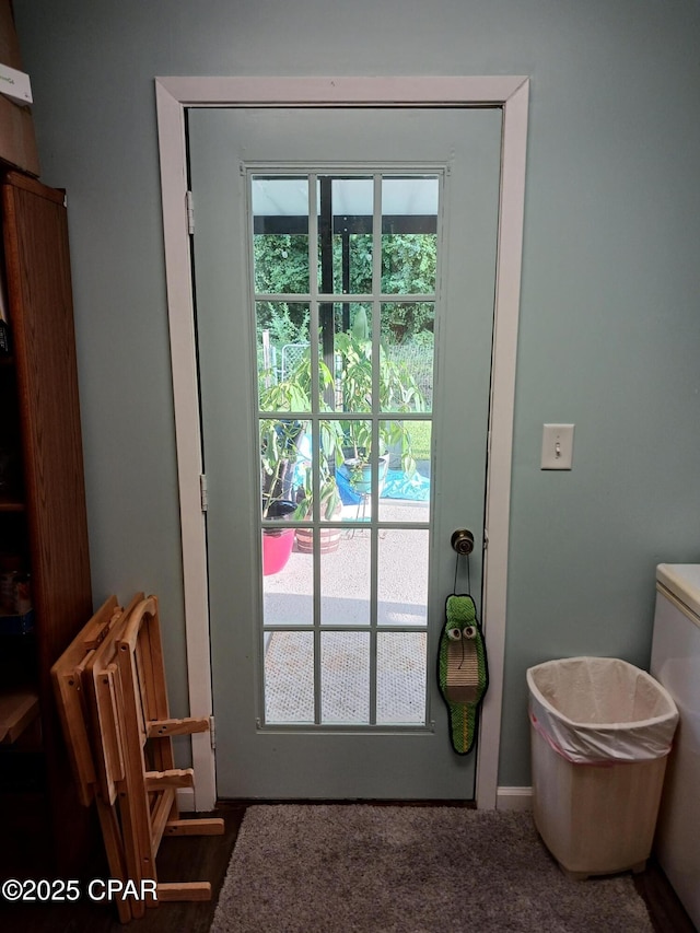 doorway to outside featuring radiator heating unit