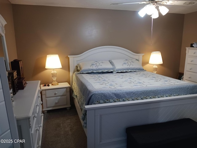 bedroom featuring dark carpet and ceiling fan