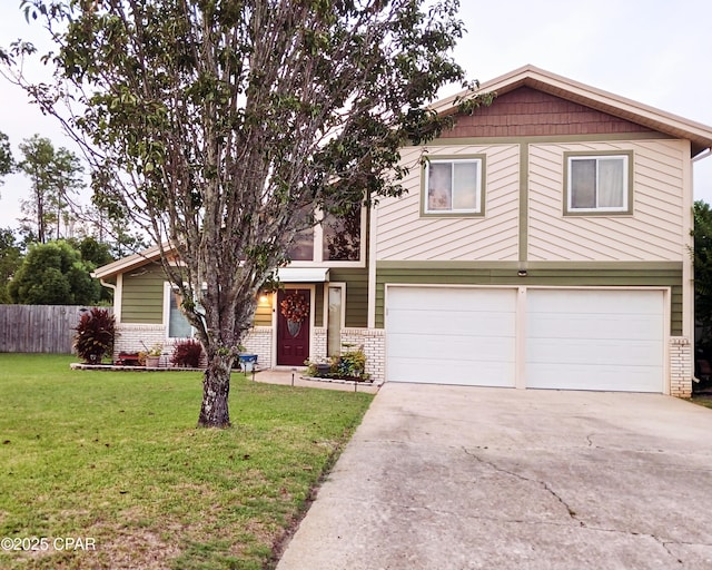 view of front facade with a front yard and a garage