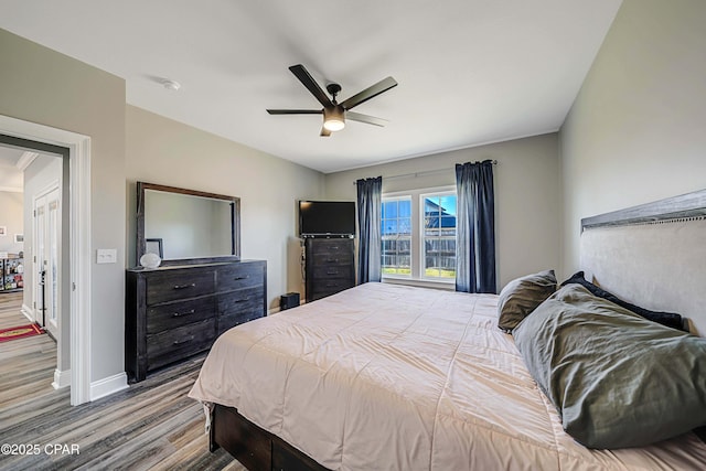 bedroom with ceiling fan and light wood-type flooring