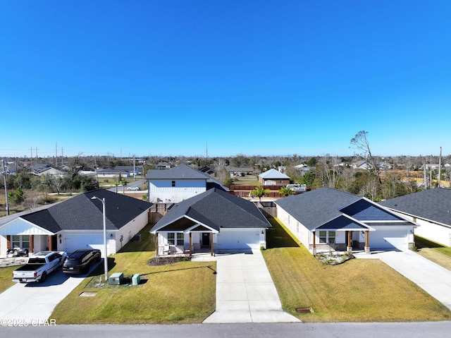 view of front facade with a garage and a front yard