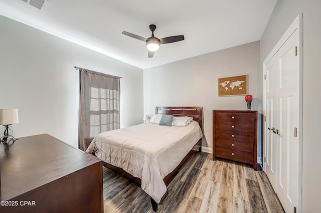 bedroom featuring ceiling fan and wood-type flooring