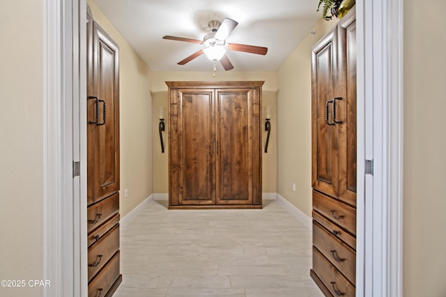 interior space with light hardwood / wood-style floors and ceiling fan
