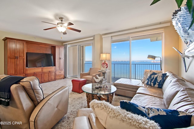tiled living room with ceiling fan