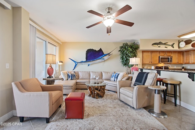 tiled living room featuring ceiling fan