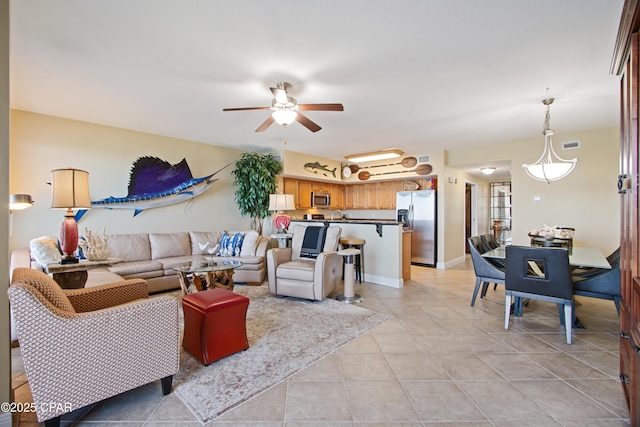 tiled living room with ceiling fan