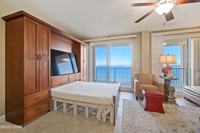 tiled bedroom featuring access to outside and ceiling fan