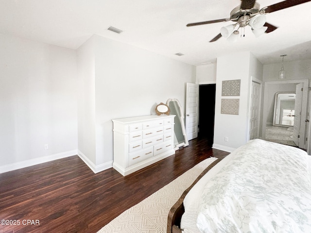 bedroom with dark wood-type flooring and ceiling fan