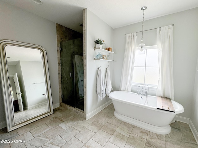 bathroom featuring separate shower and tub