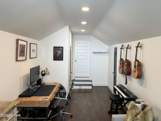 office space featuring dark hardwood / wood-style flooring, a wall mounted air conditioner, and vaulted ceiling