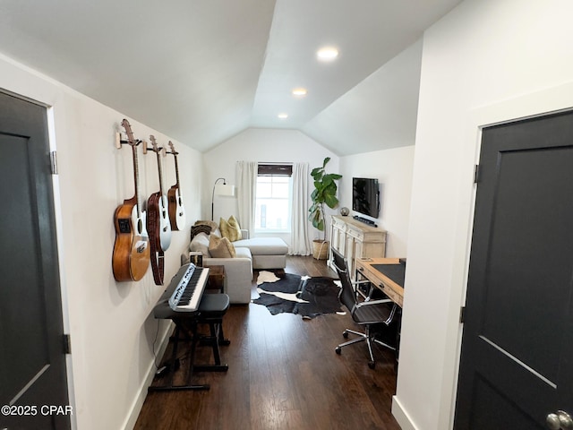 office space featuring vaulted ceiling and dark hardwood / wood-style flooring