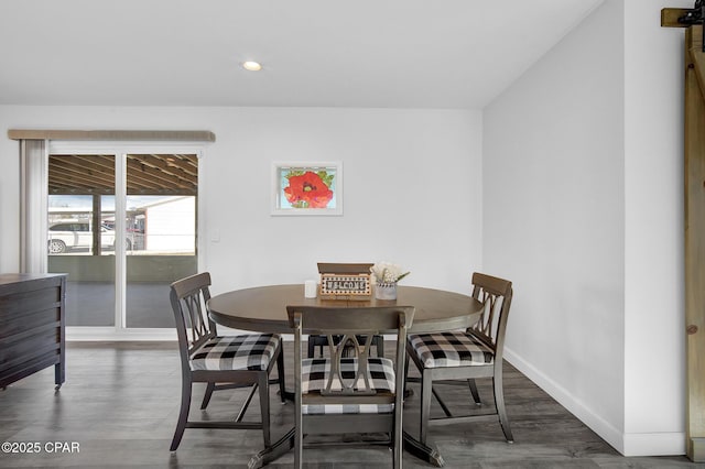 dining space featuring dark hardwood / wood-style floors