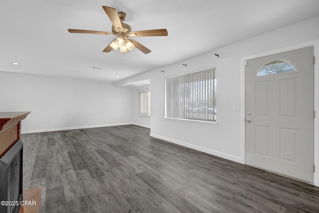 entryway with ceiling fan and dark hardwood / wood-style flooring