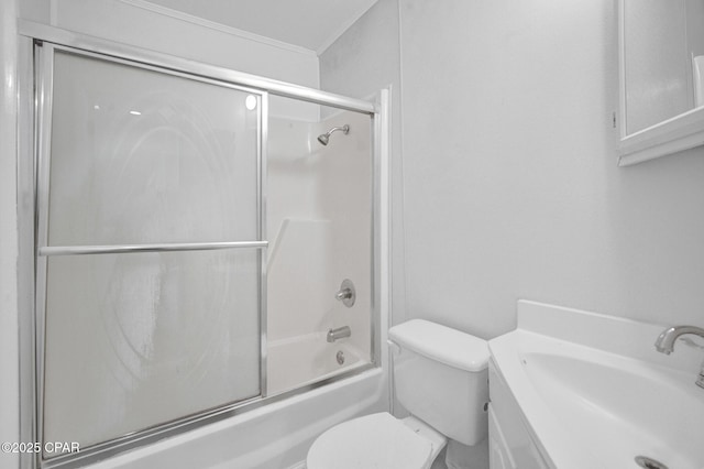 full bathroom with toilet, vanity, and combined bath / shower with glass door