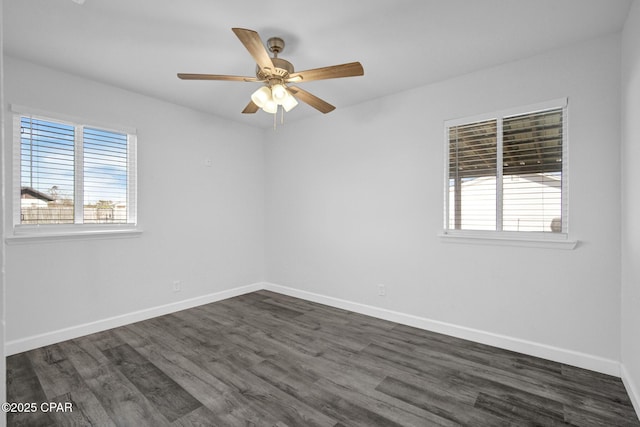 spare room with ceiling fan, plenty of natural light, and dark hardwood / wood-style floors