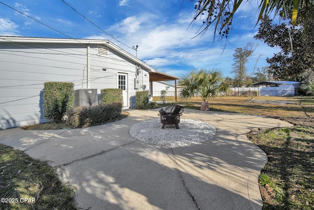 exterior space with an outdoor fire pit