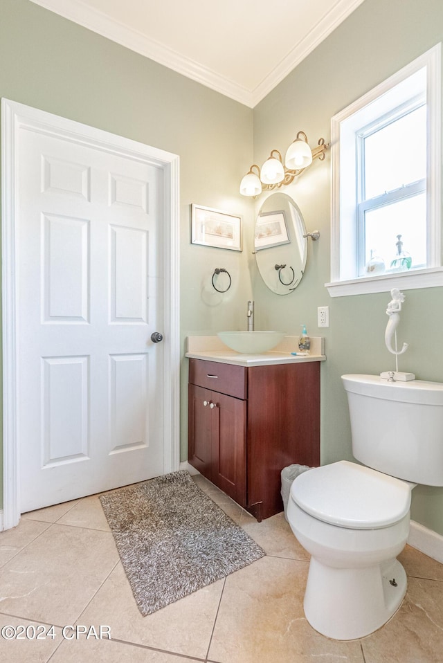 bathroom with ornamental molding, vanity, tile patterned floors, and toilet