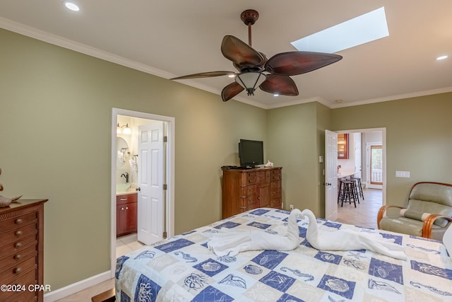 bedroom featuring light tile patterned floors, crown molding, ceiling fan, a skylight, and ensuite bathroom