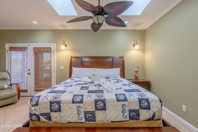 bedroom featuring ornamental molding, access to exterior, a skylight, and light tile patterned floors