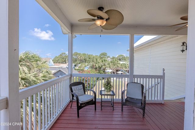 wooden terrace featuring ceiling fan