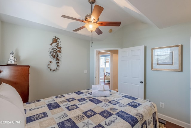 bedroom featuring ceiling fan and vaulted ceiling