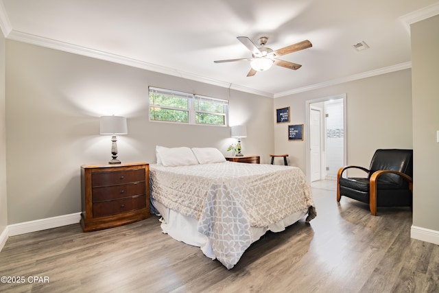 bedroom featuring ceiling fan, hardwood / wood-style flooring, and ornamental molding