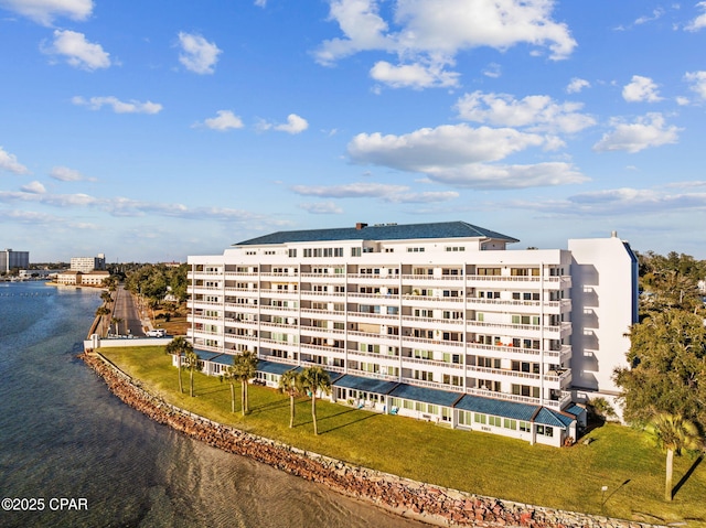 view of building exterior with a water view