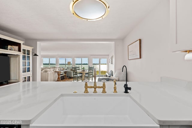 kitchen featuring sink and a textured ceiling