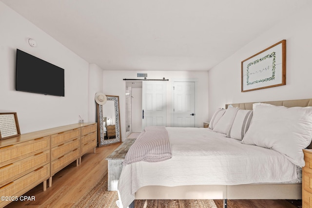 bedroom with light hardwood / wood-style flooring