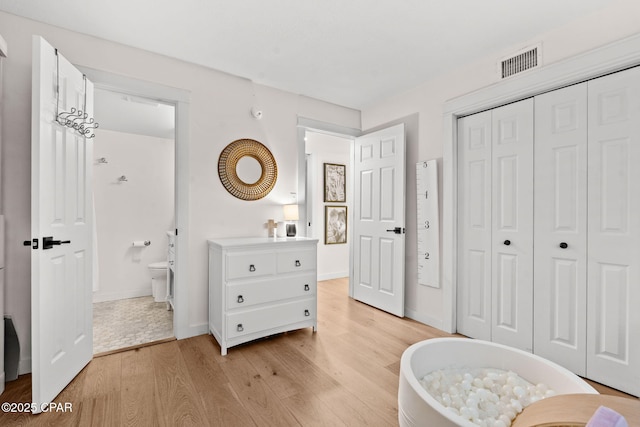 bedroom with light hardwood / wood-style flooring