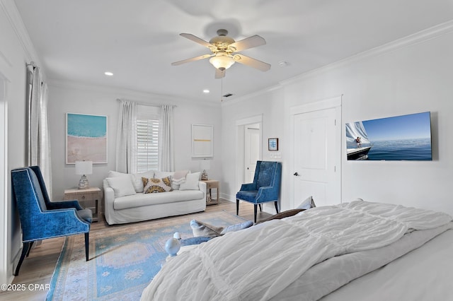 bedroom featuring crown molding, ceiling fan, and hardwood / wood-style flooring