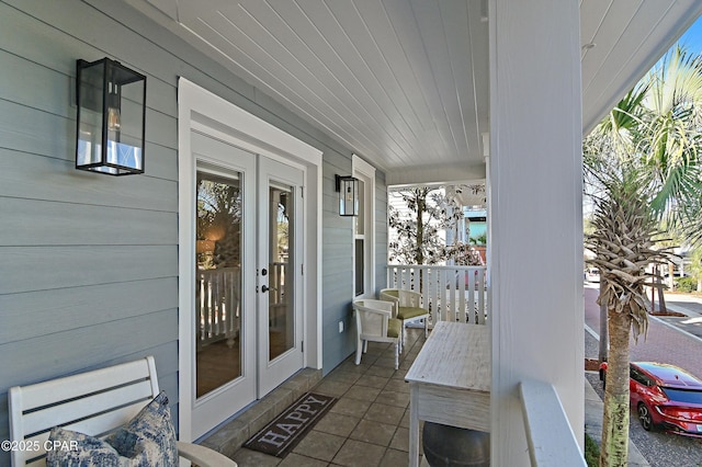 view of patio / terrace featuring a porch and french doors