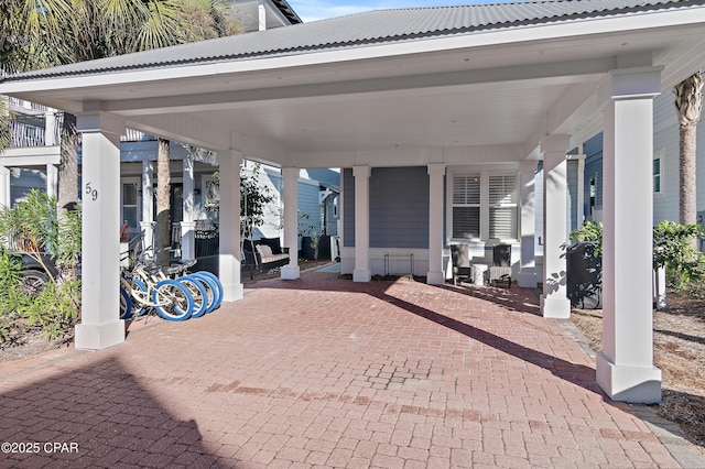 view of patio / terrace featuring a carport