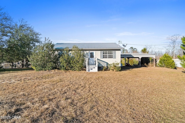 back of house with a yard