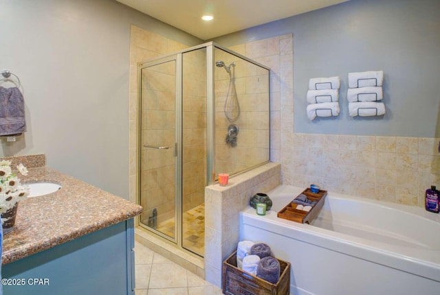 bathroom with tile patterned floors, vanity, and independent shower and bath