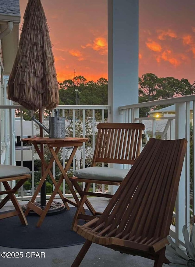 view of balcony at dusk