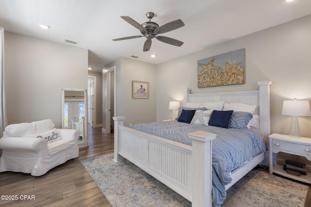 6509 W Sundew Marsh Trl, Panama City Beach, FL 32413 - bedroom with wood finished floors, recessed lighting, and ceiling fan