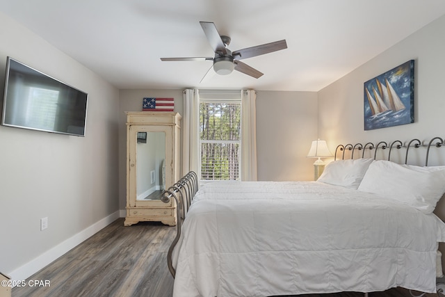 6509 W Sundew Marsh Trl, Panama City Beach, FL 32413 - bedroom featuring baseboards, dark wood finished floors, and ceiling fan