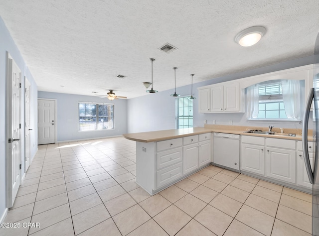 kitchen featuring white cabinetry, kitchen peninsula, ceiling fan, and dishwasher